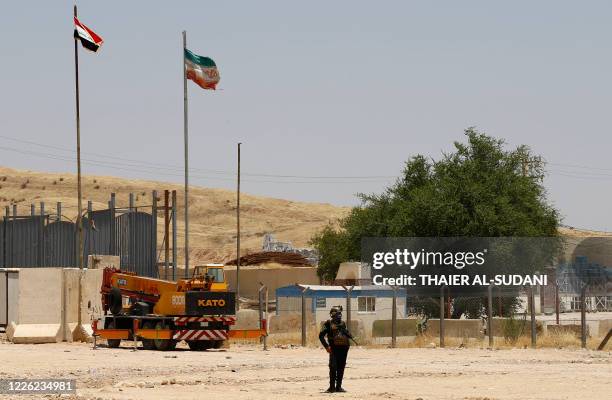 Member of the Iraqi forces stands guard on the Iraqi side of the Mandali crossing on the border with Iran on July 11, 2020. - Iraqi Prime Minister...