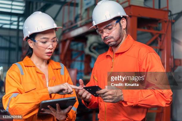 engineers finding mistake of product. - disagreement at work stock pictures, royalty-free photos & images