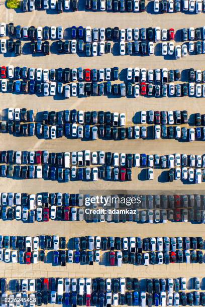 aerial view of parked cars - car dealership covid stock pictures, royalty-free photos & images