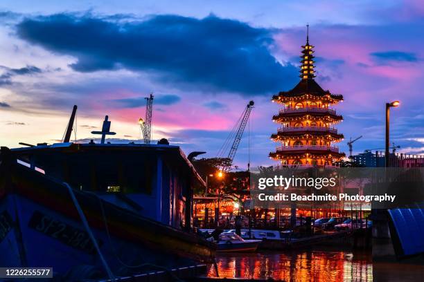 scenic view of the sibu wharf and the town's oldest temple in sibu, sarawak , malaysian borneo. - sibu river stock pictures, royalty-free photos & images