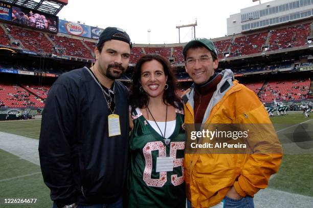 Journalist David Price and Ricardo Chavira meet with Lia Edwards when they attend the New York Jets vs Tampa Bay Buccaneers game at The Meadowlands...