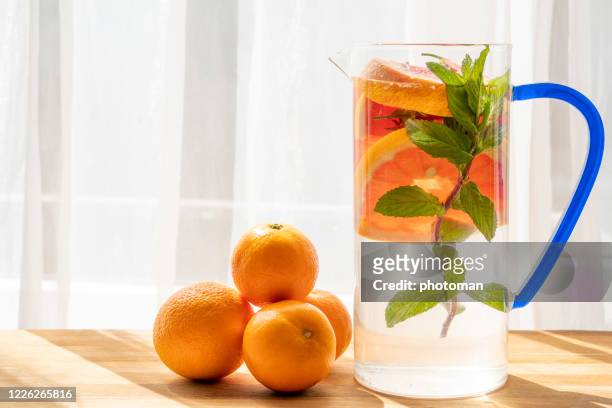 vitamin and alkaline detox water under sunlight. - carafe stock pictures, royalty-free photos & images