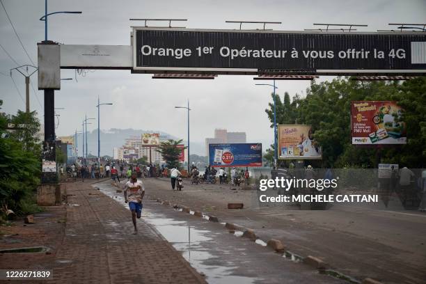 Protesters gather on the Martyrs bridge to stop the circulation through barricades of Bamako on July 11, 2020. - Malian Prime Minister Boubou Cisse...