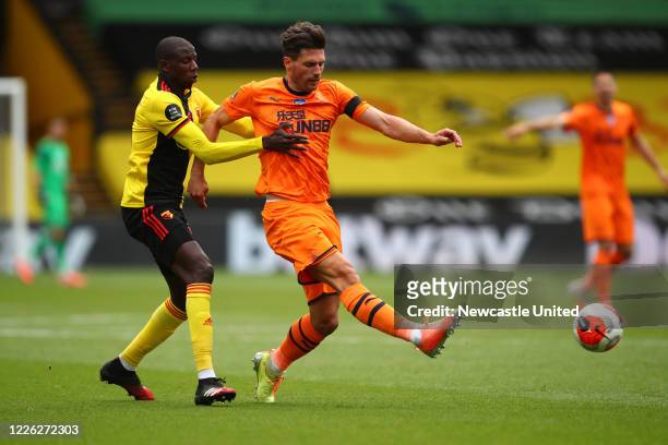 Fabian Schar of Newcastle United in action with Abdoulaye Doucoure of Watford during the Premier League match between Watford FC and Newcastle United...