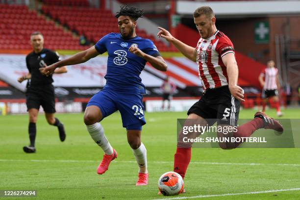 Sheffield United's English defender Jack O'Connell vies with Chelsea's English defender Reece James during the English Premier League football match...