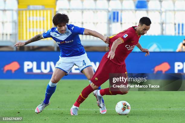 Nikola Klalinic of AS Roma competes for the ball with Sandro Tonali of Brescia Calcio during the Serie A match between Brescia Calcio and AS Roma at...