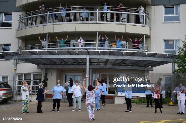 Staff at Abbeydale Court Care Home take part in Clap for Carers and key workers during ninth week of lockdown on May 21, 2020 in Hamilton, United...