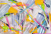 Disposable single use plastic objects such as bottles, cups, forks, spoons and drinking straws