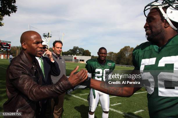 Boxer Floyd Mayweather, Jr. Meets with New York Jets player David Harris when he visits the New York Jets practice at the Atlantic Health Jets...