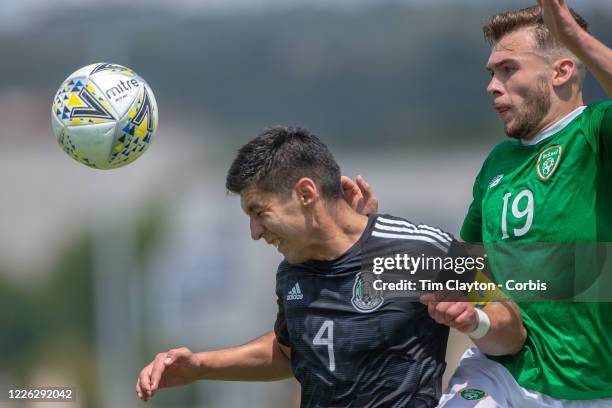 June 15. Jesús Angulo of Mexico and Aaron Drinan of the Republic of Ireland challenge for the ball during the Republic of Ireland U21 V Mexico U22,...