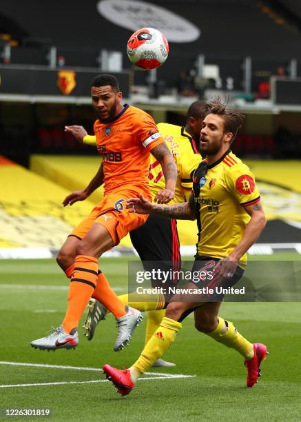 Jamaal Lascelles of Newcastle United in action with Kiko Femenia of Watford during the Premier League match between Watford FC and Newcastle United...
