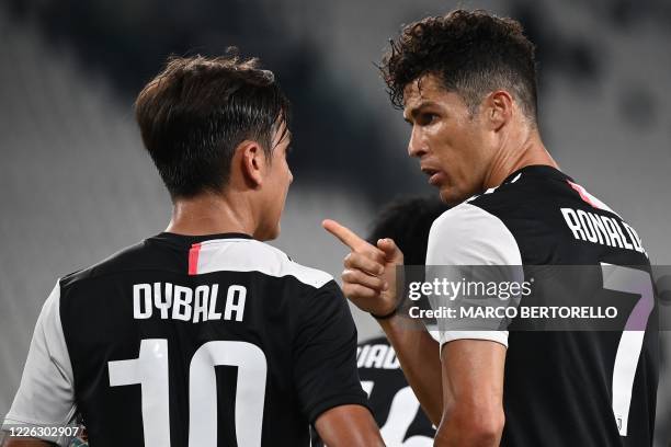 Juventus' Portuguese forward Cristiano Ronaldo celebrates with Juventus' Argentine forward Paulo Dybala after scoring a penalty during the Italian...