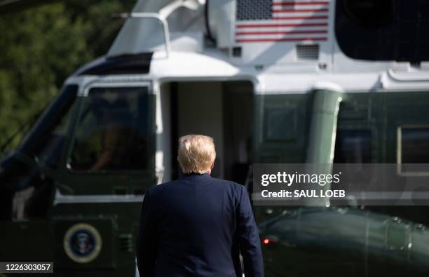 President Donald Trump walks to Marine One prior to departing from the South Lawn of the White House in Washington, DC, July 11 as he travels to...