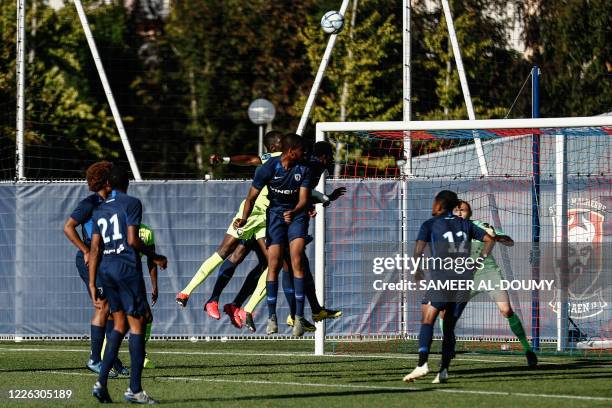 Paris FC and Caen's players vy during the French L2 friendly football match between Caen and Paris FC at the Michel d'Ornano Stadium in Caen,...