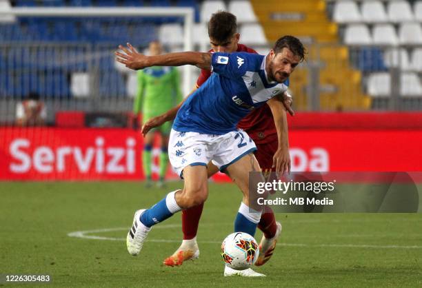 Daniele Dessena of Brescia Calcio competes for the ball with Gonzalo Villar of AS Roma during the Serie A match between Brescia Calcio and AS Roma at...