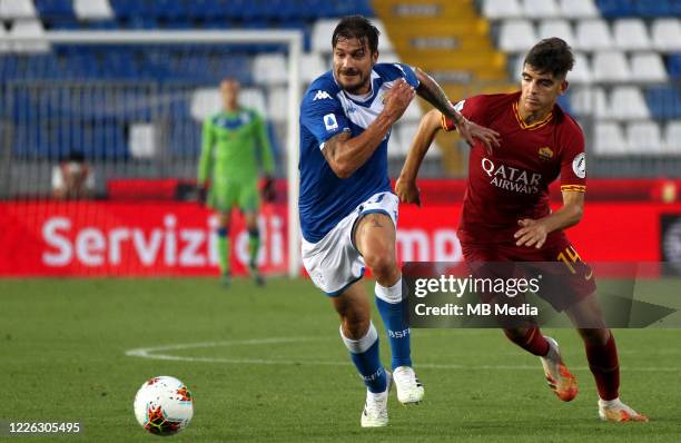 Daniele Dessena of Brescia Calcio competes for the ball with Gonzalo Villar of AS Roma during the Serie A match between Brescia Calcio and AS Roma at...