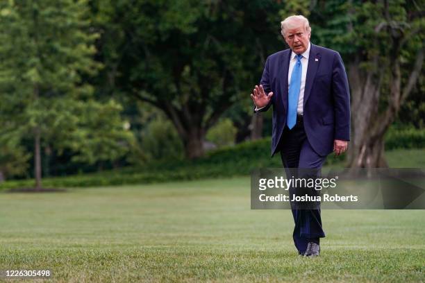 President Donald Trump walks to the White House after visiting Walter Reed Military Medical Center on July 11, 2020 in Washington, DC. Trump visited...