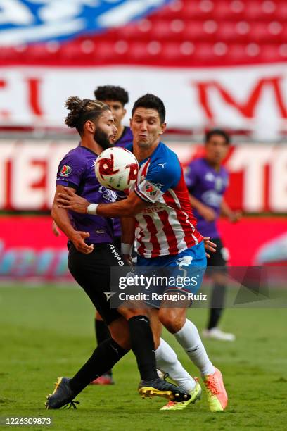 Jesús Molina of Chivas fights for the ball with Saul Huerta of Mazatlan during the match between Chivas and Mazataln FC as part of the friendly...