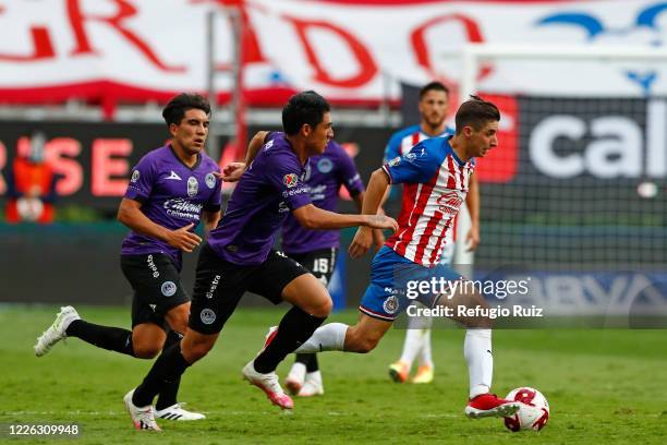 Isaac Brizuela of Chivas fights for the ball with David Arce of Mazatlan during the match between Chivas and Mazataln FC as part of the friendly...