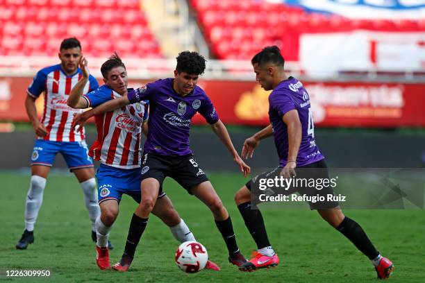 Isaac Brizuela of Chivas fights for the ball with Candido Ramirez of Mazatlan during the match between Chivas and Mazataln FC as part of the friendly...