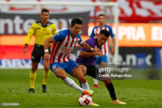 Jesús Molina of Chivas fights for the ball with Paul Rocha of Mazatlan during the match between Chivas and Mazataln FC as part of the friendly...
