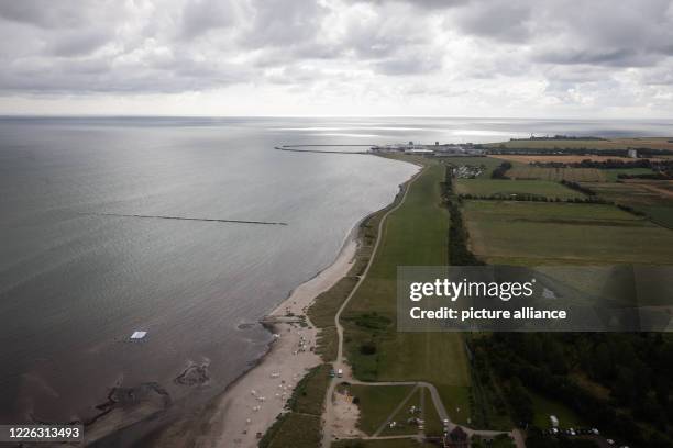 July 2020, Schleswig-Holstein, Fehmarn: The Baltic Sea coast at the nature reserve Grüner Brink near the ferry pier Puttgarden, where supporters and...