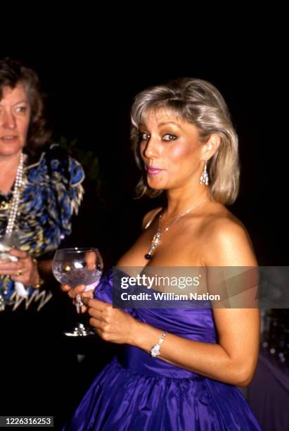 American actress Shera Danese poses for a portrait during the Women's Wear Daily party circa September, 1987 at Elizabeth Taylor's estate in Beverly...