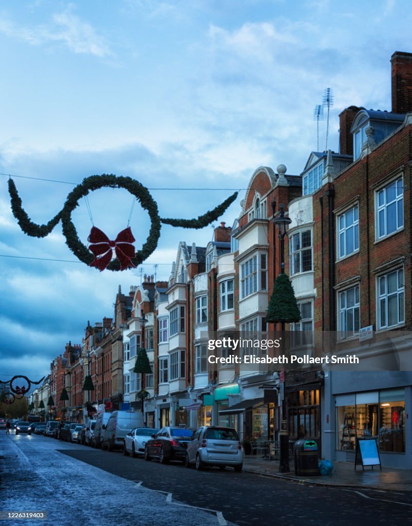 High street in St. John's Wood at dusk during winter holidays