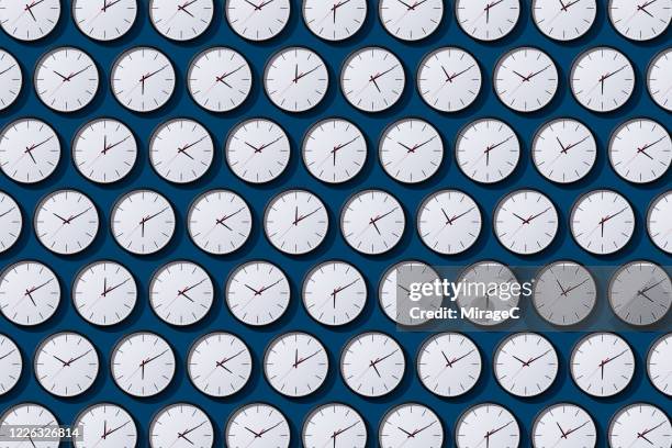 arranged timezone clocks on blue - clocks stockfoto's en -beelden