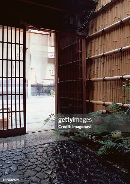 front door in traditional japanese style - sliding door exit stock pictures, royalty-free photos & images