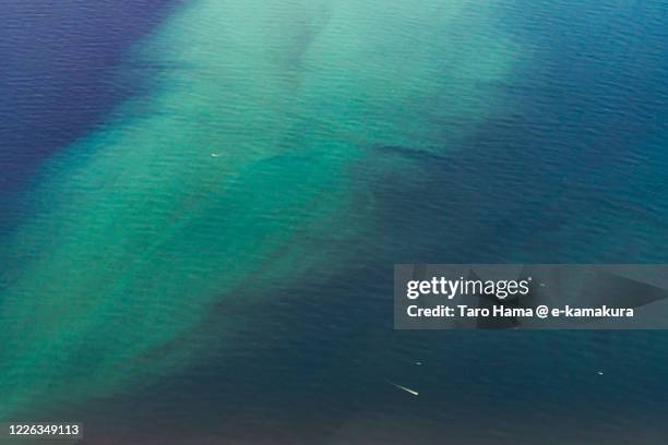 phytoplankton outbreak on pacific ocean in kanagawa prefecture of japan aerial view from airplane - phytoplankton stock pictures, royalty-free photos & images