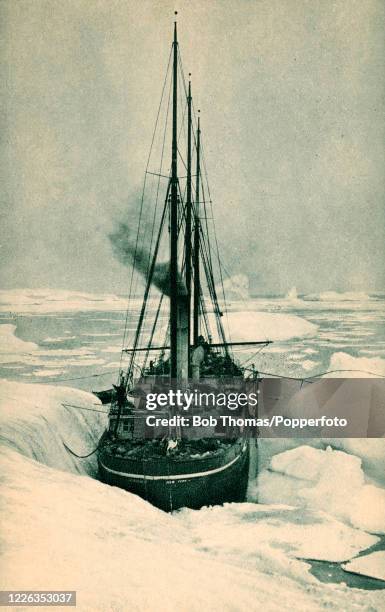 Vintage postcard featuring the SS Roosevelt, Robert Peary's ship during his North Pole expedition, taking water alongside a glacier at Cape York,...