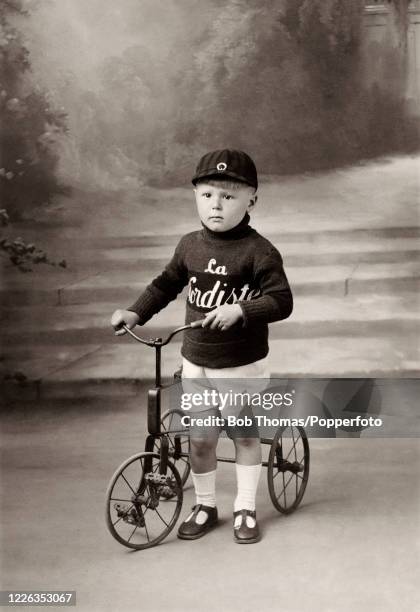 Vintage French postcard of young boy on his tricycle Vintage French postcard of young boy on his tricycle