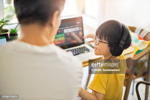 home schooling lifestyle image. - malaysia father and son stockfoto's en -beelden