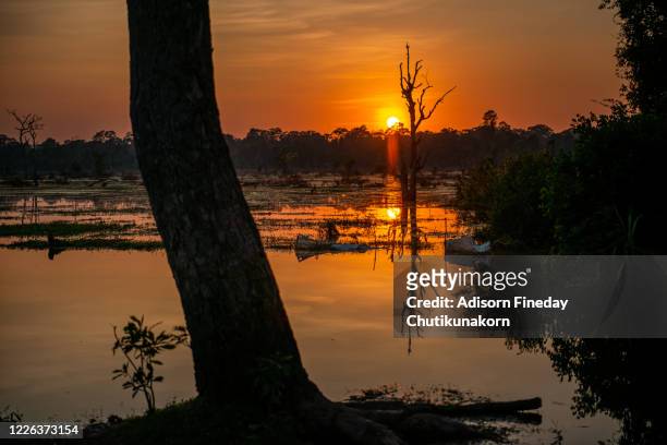 sunset over tonle sap lake ,siemreap cambodia - tonle sap stock pictures, royalty-free photos & images