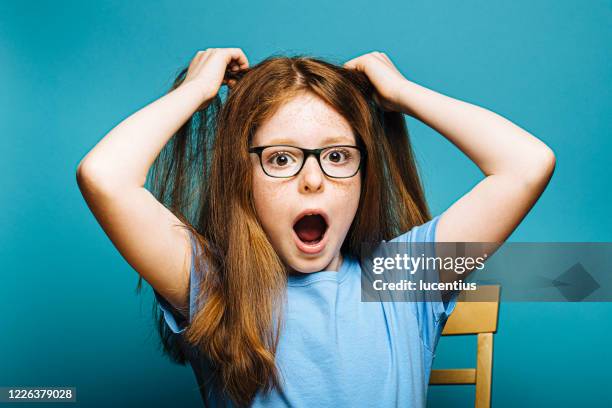 young girl with eyeglasses - child pulling hair stock pictures, royalty-free photos & images