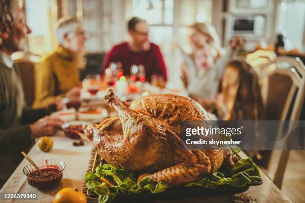 close up of thanksgiving turkey on dining table. - turkey meat stock pictures, royalty-free photos & images