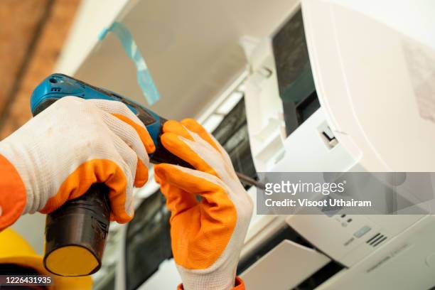 air technician and tools - air conditioner installation stock pictures, royalty-free photos & images