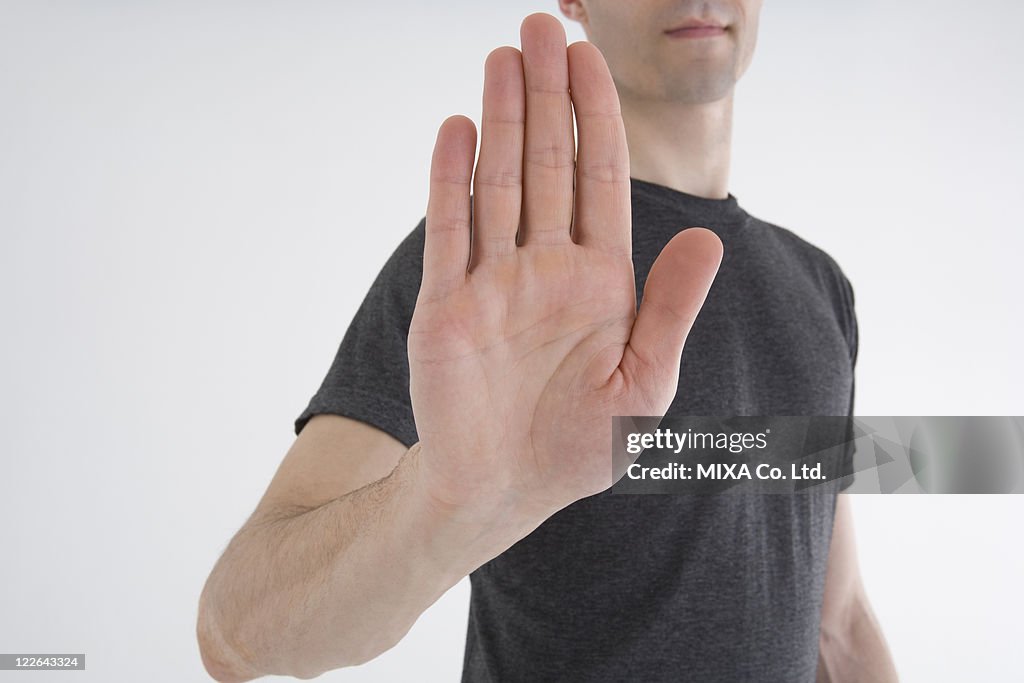 Man showing stop gesture