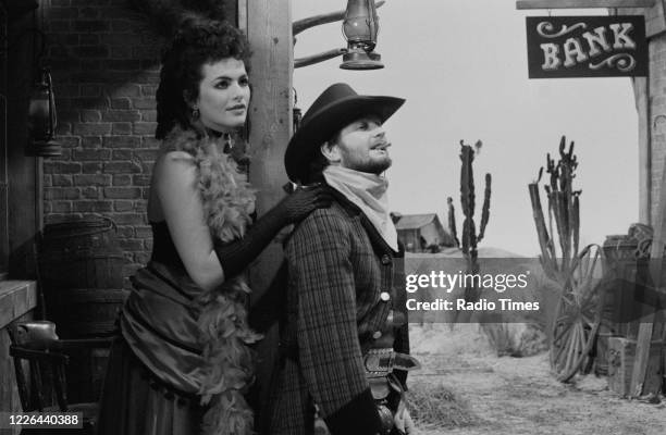 Comedian Kenny Everett and actress Cleo Rocos filming a sketch for the BBC television series 'The Kenny Everett Television Show', January 8th 1984.