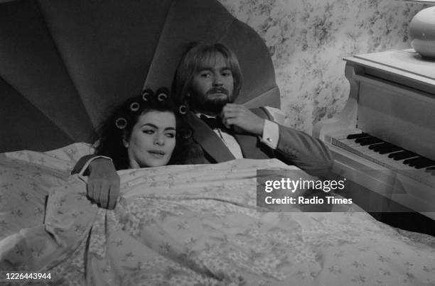 Comedian Kenny Everett and actress Cleo Rocos in bed in a sketch for the BBC television series 'The Kenny Everett Television Show', January 8th 1984.