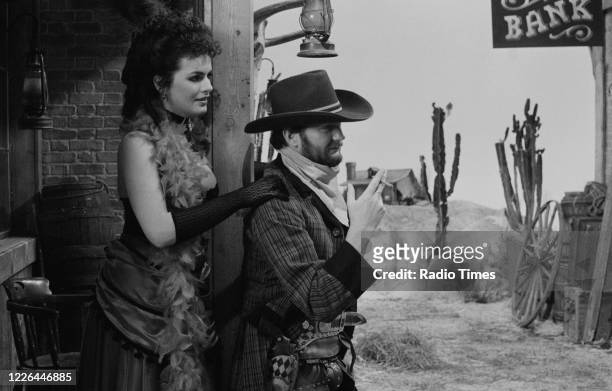 Comedian Kenny Everett and actress Cleo Rocos filming a sketch for the BBC television series 'The Kenny Everett Television Show', January 8th 1984.