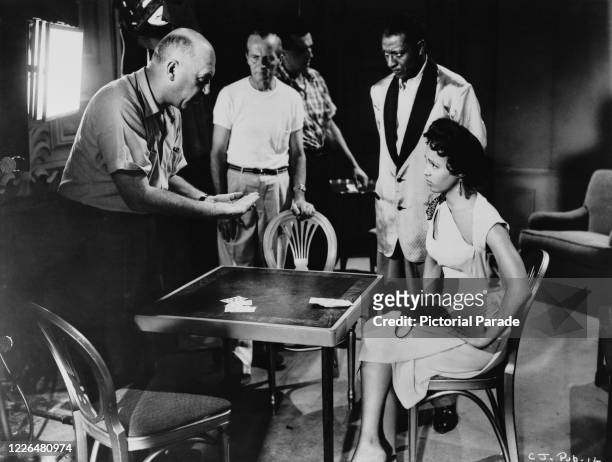 Director Otto Preminger with lead actress Dorothy Dandridge on the set of his film 'Carmen Jones', 1954.