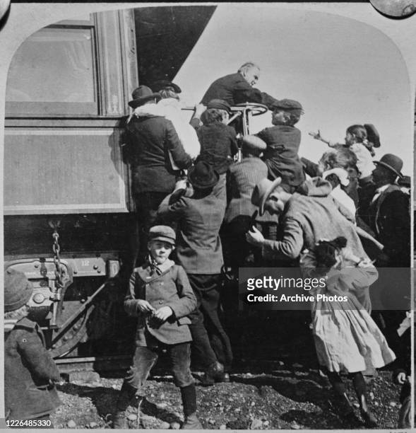 President William McKinley meets children from the back of the presidential train in Canton, Ohio, during his election campaign, 1900.