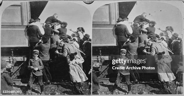 President William McKinley meets children from the back of the presidential train in Canton, Ohio, during his election campaign, 1900.