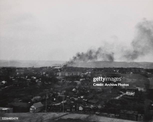 Smoke rises from the city during the race riots in Newark, New Jersey, in July 1967. The riots were sparked by the beating of cab driver John William...