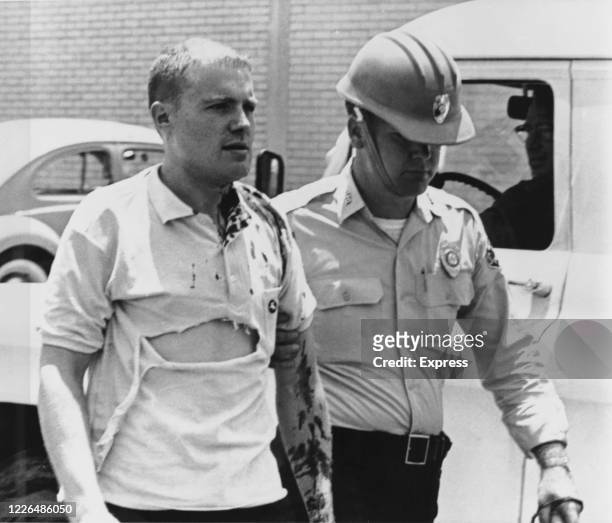 Professor John Salter Jr of Tougaloo College, is led away after being forcibly restrained by riot police in Jackson, Mississippi, whilst protesting...