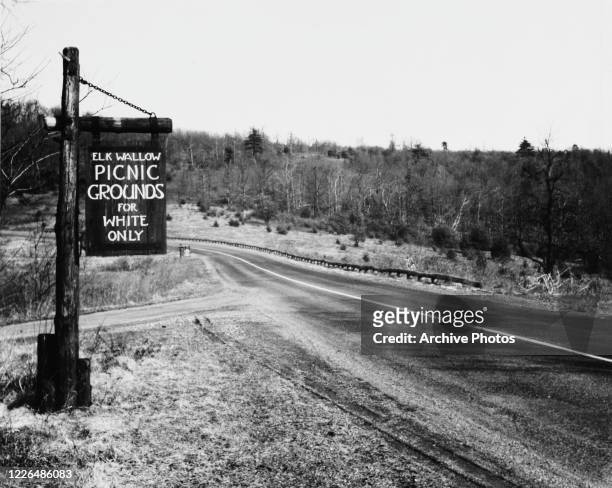 Sign at Elkwallow Picnic Grounds in Shenandoah National Park, Virginia, reading 'Picnic grounds for white only', USA, circa 1940.