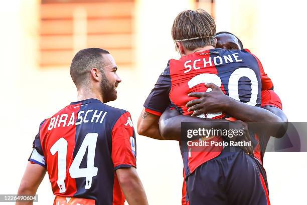 Lasse Schone of Genoa celebrates with his team-mates Davide Biraschi and Cristian Zapata after scoring a goal on a free kick during the Serie A match...