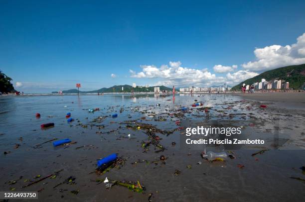 dirty beach - brazil ocean stock-fotos und bilder